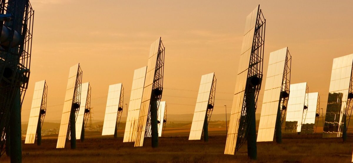 Panoramic web banner field of solar mirror panels harnessing the sun's rays to provide alternative green energy at sunrise or sunset istock credit: dmbaker