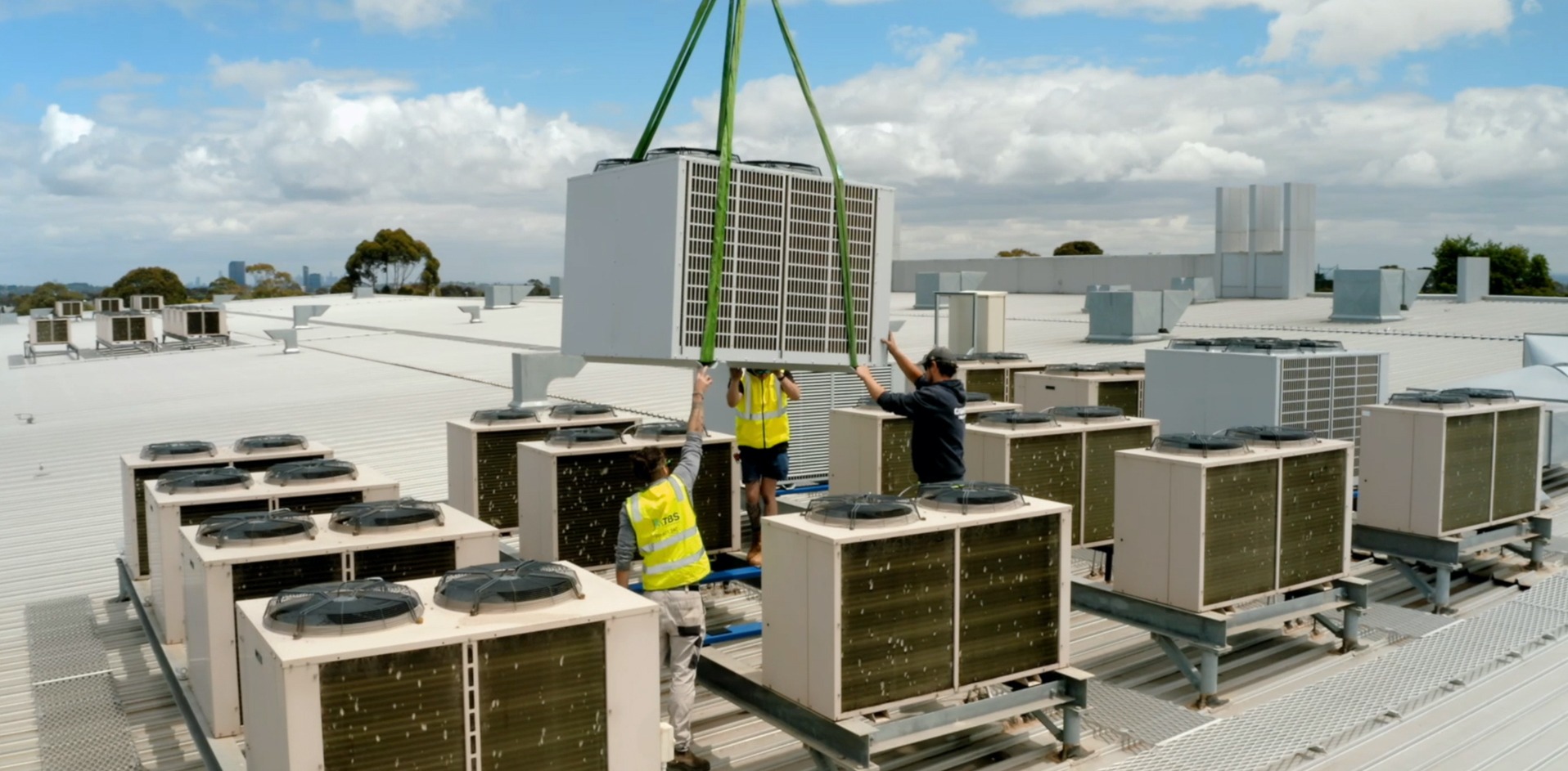 Air Conditioning Replacement on roof of shopping center Melbourne with crane
